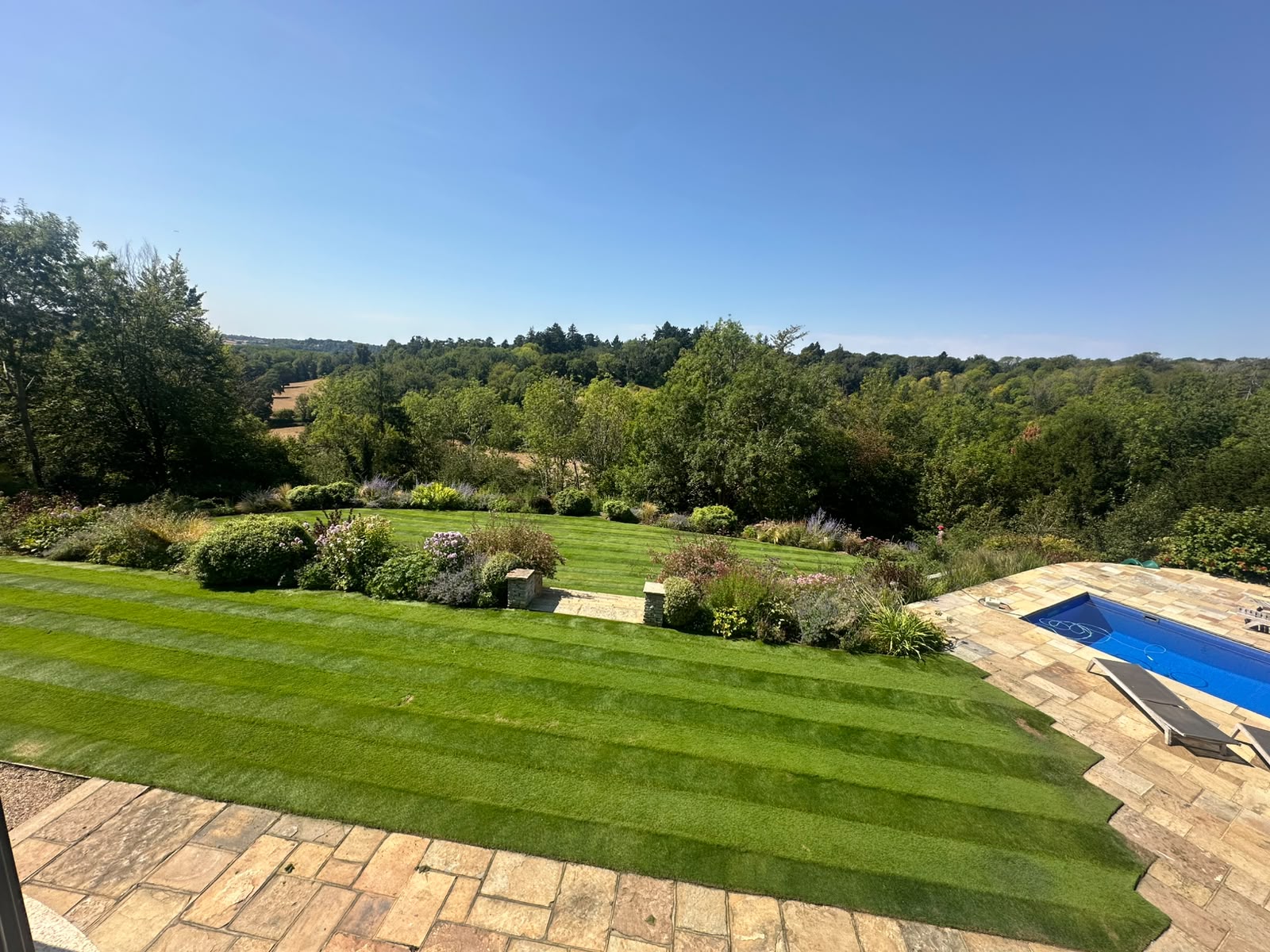 Estate lawn with landscaped garden and countryside views